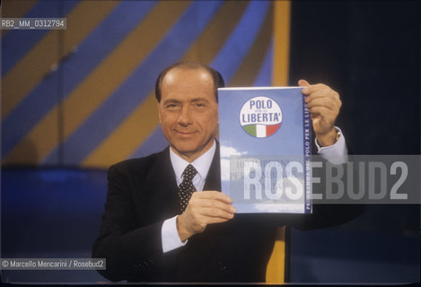 Rome, 1996. Politician Silvio Berlusconi takes part in the TV program Porta a Porta to present the electoral program of his party, the Polo delle Libertà (PDL) / Roma, 1996. Il politico Silvio Berlusconi interviene nel programma TV Porta a Porta per presentare il programma elettorale del suo partito, il Polo delle Libertà - ©Marcello Mencarini/Rosebud2