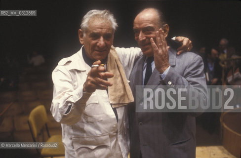 Rome, Pius XII Auditorium (concert hall of the Santa Cecilia Academy Orchestra), 1989. Musician Leonard Bernstein during a rehearsal with musicologist Francesco Siciliani / Roma, Auditorium Pio XII (sede dei concerti dellorchestra dellAccademia nazionale di Santa Cecilia), 1989. Leonard Bernstein durante una prova insieme al musicologo Francesco Siciliani - ©Marcello Mencarini/Rosebud2