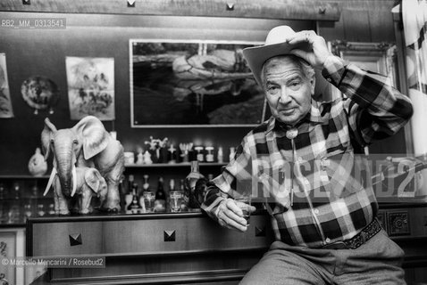 Milan, about 1985. Italian cartoonist Gianluigi Bonelli, author of the character Tex Willer, in his studio / Milano, 1985 circa. Il disegnatore di fumetti Gianluigi Bonelli, autore di Tex Willer, nel suo studio - ©Marcello Mencarini/Rosebud2