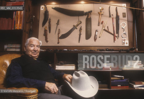 Milan, about 1985. Italian cartoonist Gianluigi Bonelli, author of the character Tex Willer, in his studio / Milano, 1985 circa. Il disegnatore di fumetti Gianluigi Bonelli, autore di Tex Willer, nel suo studio - ©Marcello Mencarini/Rosebud2