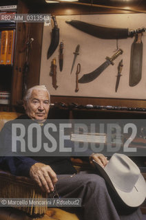 Milan, about 1985. Italian cartoonist Gianluigi Bonelli, author of the character Tex Willer, in his studio / Milano, 1985 circa. Il disegnatore di fumetti Gianluigi Bonelli, autore di Tex Willer, nel suo studio - ©Marcello Mencarini/Rosebud2
