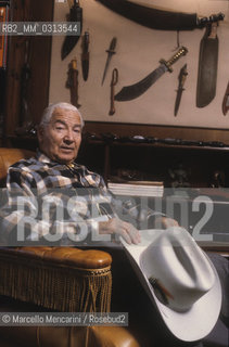 Milan, about 1985. Italian cartoonist Gianluigi Bonelli, author of the character Tex Willer, in his studio / Milano, 1985 circa. Il disegnatore di fumetti Gianluigi Bonelli, autore di Tex Willer, nel suo studio - ©Marcello Mencarini/Rosebud2