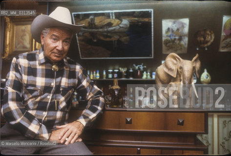 Milan, about 1985. Italian cartoonist Gianluigi Bonelli, author of the character Tex Willer, in his studio / Milano, 1985 circa. Il disegnatore di fumetti Gianluigi Bonelli, autore di Tex Willer, nel suo studio - ©Marcello Mencarini/Rosebud2