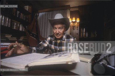 Milan, about 1985. Italian cartoonist Gianluigi Bonelli, author of the character Tex Willer, in his studio / Milano, 1985 circa. Il disegnatore di fumetti Gianluigi Bonelli, autore di Tex Willer, nel suo studio - ©Marcello Mencarini/Rosebud2