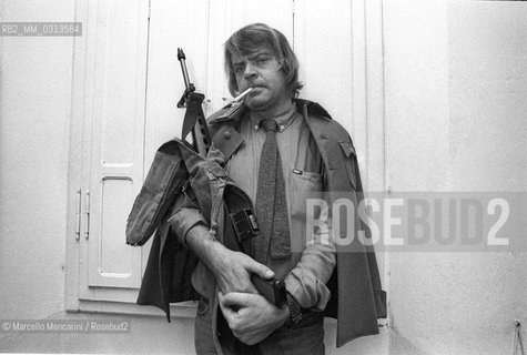 Bologna, 1981. Italian cartoonist Bonvi (Franco Bonvicini) in his studio dressed as a character of his comic strip Sturmtruppen / Il fumettista Bonvi (Franco Bonvicini) nel suo studio vestito come un personaggio della sua striscia Sturmtruppen, 1981 - ©Marcello Mencarini/Rosebud2
