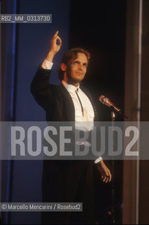 Sanremo Music Festival 1988. Festival TV presenter, Spanish pop singer Miguel Bosé, performing / Festival di Sanremo 1988. Il cantante Miguel Bosè, presentatore televisivo del Festival, canta una canzone - ©Marcello Mencarini/Rosebud2