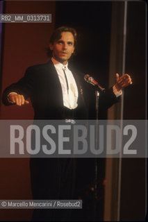 Sanremo Music Festival 1988. Festival TV presenter, Spanish pop singer Miguel Bosé, performing / Festival di Sanremo 1988. Il cantante Miguel Bosè, presentatore televisivo del Festival, canta una canzone - ©Marcello Mencarini/Rosebud2