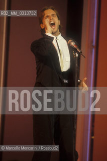 Sanremo Music Festival 1988. Festival TV presenter, Spanish pop singer Miguel Bosé, performing / Festival di Sanremo 1988. Il cantante Miguel Bosè, presentatore televisivo del Festival, canta una canzone - ©Marcello Mencarini/Rosebud2