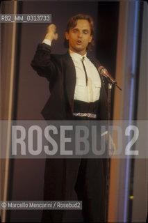 Sanremo Music Festival 1988. Festival TV presenter, Spanish pop singer Miguel Bosé, performing / Festival di Sanremo 1988. Il cantante Miguel Bosè, presentatore televisivo del Festival, canta una canzone - ©Marcello Mencarini/Rosebud2