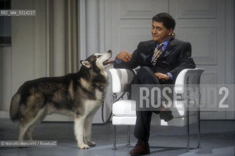 Rome, 1996. Italian politician Rocco Buttiglione and his dog participating in a tv show / Roma, 1996. Il politico Rocco Buttiglione e il suo cane durante la trasmissione televisiva Porta a porta - ©Marcello Mencarini/Rosebud2