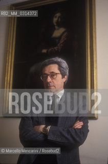 Rome, 1991. Italian musicologist Bruno Cagli in front of a portrait of Saint Cecilia  patroness of musicians / Roma, 1991. Il musicologo Bruno Cagli davanti a un ritratto di Santa Cecilia, patrona dei musicisti - ©Marcello Mencarini/Rosebud2