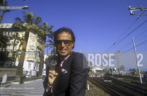 Sanremo Music Festival 1988. Italian pop singer Franco Califano poses in the city streets. He his at Festival to perform Io per le strade di quartiere (I on The Neighborhood Streets, ranked thirteenth) / Festival di Sanremo 1988. Il cantante Franco Califano posa per le vie della città. Partecipa al Festival con la canzone Io per le strade di quartiere (tredicesima classificata) - ©Marcello Mencarini/Rosebud2