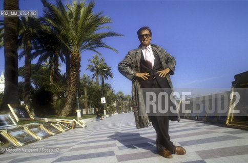 Sanremo Music Festival 1988. Italian pop singer Franco Califano poses in the city streets. He his at Festival to perform Io per le strade di quartiere (I on The Neighborhood Streets, ranked thirteenth) / Festival di Sanremo 1988. Il cantante Franco Califano posa per le vie della città. Partecipa al Festival con la canzone Io per le strade di quartiere (tredicesima classificata) - ©Marcello Mencarini/Rosebud2