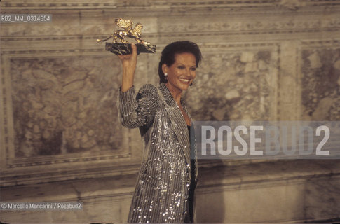 Venice Film Festival 1993, Actress Claudia Cardinale holding the Golden Lion Award for career achievement / Mostra del Cinema di Venezia 1993. Lattrice Claudia Cardinale con il premio Leone doro alla carriera - ©Marcello Mencarini/Rosebud2