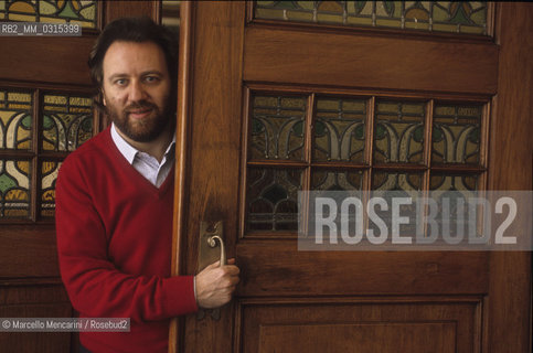Amsterdam, 1991. Riccardo Chailly,  conductor of the Royal Concertgebouw Orchestra (KCO), opens the door of his house / Amsterdam, 1991. Riccardo Chailly, direttore della  Royal Concertgebouw Orchestra (KCO), apre la porta della sua casa di Amsterdam - ©Marcello Mencarini/Rosebud2