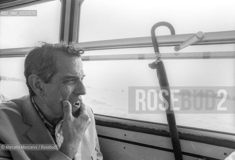 Venice, 1982. Italian composer Aldo Clementi on a steamboat / Venezia, 1982. Il compositore Aldo Clementi in vaporetto - ©Marcello Mencarini/Rosebud2