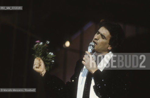 Sanremo Music Festival 1984. Italian pop singer Toto Cutugno, iperforming the song Serenata, that will finish third / Festival di Sanremo 1984. Toto Cutugno canta la canzone Serenata, che si classificherà al terzo posto - ©Marcello Mencarini/Rosebud2