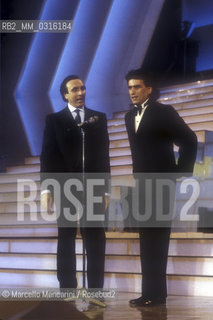 Sanremo Music festival 1987. Tv presenter Pippo Baudo and Italian pop singer Toto Cutugno, in competition with the song Figli, that will finish second / Festival di Sanremo 1987. Il presentatore Pippo Baudo e Toto Cutugno, in gara con la canzone Figli, che si classificherà al secondo posto - ©Marcello Mencarini/Rosebud2