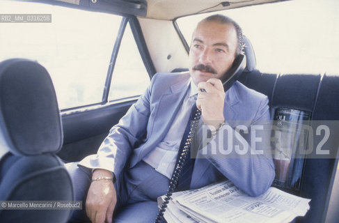 Naples, 1986. Mayor of Naples Carlo Damato phoning in a car  / Napoli, 1986. Il sindaco di Napoli Carlo DAmato in automobile mentre telefona - ©Marcello Mencarini/Rosebud2