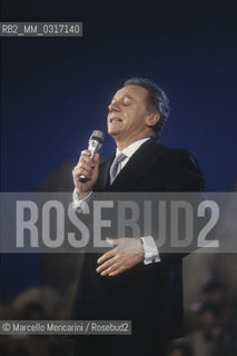 Italian pop singer Johnny Dorelli, TV presenter  of Sanremo Music Festival 1990 (with Gabriella Carlucci) / Il cantante Johnny Dorelli, presentatore TV (con Gabrilella Carlucci) del Festival di Sanremo 1990 - ©Marcello Mencarini/Rosebud2