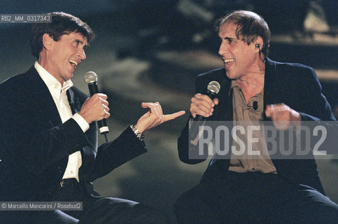 Milan, October 21, 1999. Italian pop singer Adriano Celentano on the set of his TV program Francamente me ne infischio with pop singer Gianni Morandi / Milano, 21 ottobre 1999. Il cantante Adriano Celentano sul set del suo programma televisivo Francamente me ne infischio con il cantante Gianni Morandi - ©Marcello Mencarini/Rosebud2
