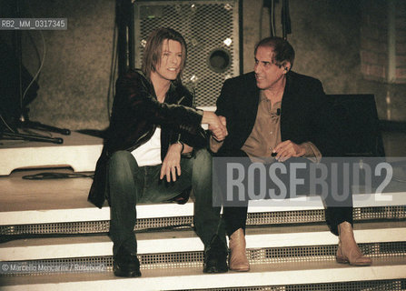 Milan, October 21, 1999. Italian pop singer Adriano Celentano on the set of his TV program Francamente me ne infischio with British pop-rock singer David Bowie / Milano, 21 ottobre 1999. Il cantante Adriano Celentano sul set del suo programma televisivo Francamente me ne infischio con il cantante David Bowie - ©Marcello Mencarini/Rosebud2