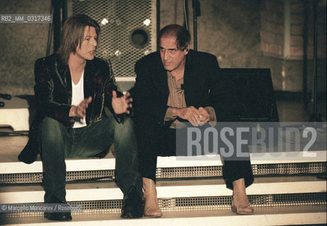 Milan, October 21, 1999. Italian pop singer Adriano Celentano on the set of his TV program Francamente me ne infischio with British pop-rock singer David Bowie / Milano, 21 ottobre 1999. Il cantante Adriano Celentano sul set del suo programma televisivo Francamente me ne infischio con il cantante David Bowie - ©Marcello Mencarini/Rosebud2