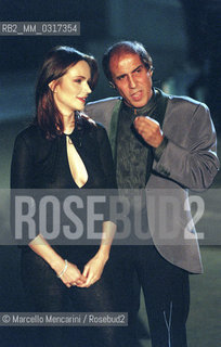 Milan, October 24, 1999. Italian pop singer Adriano Celentano on the set of his TV program Francamente me ne infischio with actress Francesca Neri / Milano, 24 ottobre 1999. Il cantante Adriano Celentano sul set del suo programma televisivo Francamente me ne infischio con lattrice Francesca Neri - ©Marcello Mencarini/Rosebud2