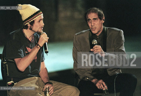 Milan, October 24, 1999. Italian pop singer Adriano Celentano on the set of his TV program Francamente me ne infischio with singer Jovanotti (Lorenzo Cherubini) / Milano, 24 ottobre 1999. Il cantante Adriano Celentano sul set del suo programma televisivo Francamente me ne infischio con il cantante Jovanotti (Lorenzo Cherubini) - ©Marcello Mencarini/Rosebud2