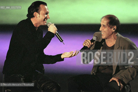 Milan, October 28, 1999. Italian pop singer Adriano Celentano on the set of his TV program Francamente me ne infischio with singer Biagio Antonacci (on the right) / Milano, 28 ottobre 1999. Il cantante Adriano Celentano sul set del suo programma televisivo Francamente me ne infischio con il cantante Biagio Antonacci (a destra) - ©Marcello Mencarini/Rosebud2