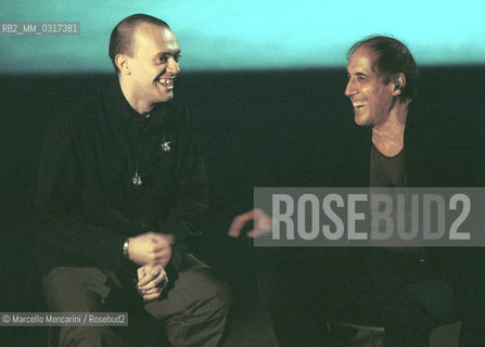 Milan, October 28, 1999. Italian pop singer Adriano Celentano on the set of his TV program Francamente me ne infischio with singer Max Pezzali (on the left) / Milano, 28 ottobre 1999. Il cantante Adriano Celentano sul set del suo programma televisivo Francamente me ne infischio con il cantante Max Pezzali (a sinistra) - ©Marcello Mencarini/Rosebud2