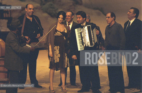 Milan, April 26, 2001. Italian pop singer Adriano Celentano on the set of his tv program 125 Milioni di Cazzate with actress Asia Argento and Romanian group Taraf de Haïdouks /Milano, 26 aprile 2001. Il cantante Adriano Celentano sul set del suo programma televisivo 125 milioni di cazzate con lattrice Asia Argento e il gruppo romeno Taraf de Haïdouks - ©Marcello Mencarini/Rosebud2