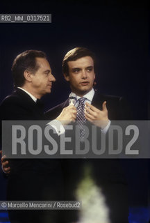 Sanremo Music Festival, 1990. Italian pop singer Gianluca Guidi -at the Festival with the song Secondo te, that will finish third in the New Proposals Category- and his father Johnny Dorelli, Festival TV presenter / Festival doi Sanremo 1990. Gianluca Guidi -al Festival con la canzone Secondo te, che si classificherà terza nella categoria Nuove proposte- e suo padre Johnny Dorelli - ©Marcello Mencarini/Rosebud2