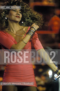 Sanremo Music festival 1991. Italian pop singers jo Squillo performing th song Siamo Donne with Sabrina Salerno / Festival di Sanremo 1991. Jo Squillo canta Siamo donne in duo con Sabrina Salerno - ©Marcello Mencarini/Rosebud2