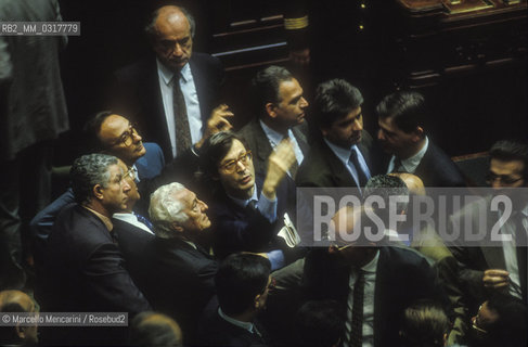 Rome, Chamber of Deputies in Palazzo Montecitorio, May 25, 1992. A group of parliamentarians, including Gianni Agnelli and Vittorio Sgarbi, talk to each other during the Parliament joint session of both Houses to elect the President of the Italian Republic, that will be Oscar Luigi Scalfaro / Roma, Palazzo Montecitorio Camera dei Deputati, 25 maggio 1992. Alcuni parlamentari, tra i quali Umberto Agnelli e Vittorio Sgarbi, parlano tra loro durante la sessione congiunta delle Camere per eleggere il Presidente della Repubblica, che sarà Oscar Luigi Scalfaro - ©Marcello Mencarini/Rosebud2