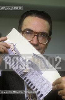 Italian theater manager Francesco Ernani showing an image of the Carlo Felice Theater in Genoa, of which he is superintendent (1991) / Il manager teatrale Francesco Ernani mostra unimmagine del Teatro Carlo Felice di Genova di cui è sovrintendente (1991) - ©Marcello Mencarini/Rosebud2