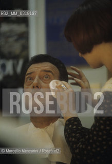 Rome, 1996. Italian politician and expert in tax law Augusti Fantozzi applying make-up in his dressing room before paricipating in a tv show / Roma, 1996. Il politico ed esperto in diritto tributario Augusto Fantozzi al trucco nel suo camerino prima di partecipare alla trasmissione televisiva Porta a porta - ©Marcello Mencarini/Rosebud2