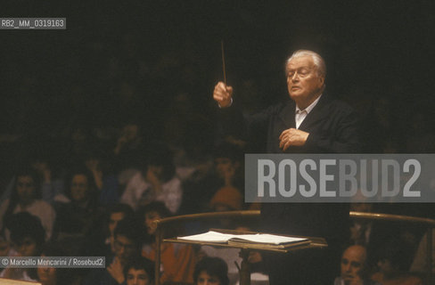 Italian conductor and composer Gianandrea Gavazzeni performing, about 1980 / Il direttore dorchestra e compositore Gianandrea Gavazzeni durante un concerto, 1980 circa - ©Marcello Mencarini/Rosebud2