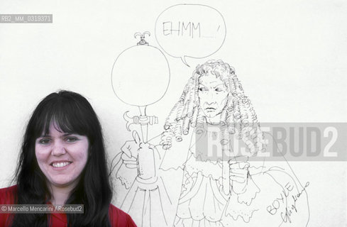 Lucca, 1984. Italian cartoonist Cinzia Ghigliano posing next to one of his drawing / Lucca, 1984. La fumettista Cinzia Ghigliano posa accanto a un suo disegno -
 ©Marcello Mencarini/Rosebud2