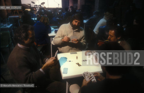 Bologna, about 1985. Italian singer-songwriter Francesco Guccini playin cards at Osteria delle dame / Bologna, 1985 circa. Il cantautore Francesco Guccini mentre gioca a carte allOsteria delle dame - ©Marcello Mencarini/Rosebud2