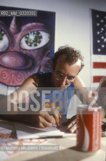 Milan, 1985. American artist Keith Haring during a performance at a Fiorucci store / Milano, 1985. Lartista Keith Haring durante una performance in un negozio Fiorucci - ©Marcello Mencarini/Rosebud2