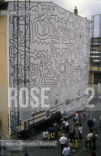 Pisa, 1989. The mural Tuttomondo by Keith Haring in progress on the rear wall of the Church of SantAntonio / Pisa.1989. Il murale Tuttomondo di Keith Haring in via di realizzazione sul muro posteriore della chiesa di SantAntonio abate- ©Marcello Mencarini/Rosebud2