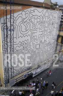 Pisa, 1989. The mural Tuttomondo by Keith Haring in progress on the rear wall of the Church of SantAntonio / Pisa.1989. Il murale Tuttomondo di Keith Haring in via di realizzazione sul muro posteriore della chiesa di SantAntonio abate- ©Marcello Mencarini/Rosebud2