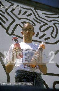 Artist Keith Haring working at the mural Tuttomondo on the rear wall of the Church of SantAntonio in Pisa, 1989 / Lartista Keith Haring mentre lavora al murale Tuttomondo sul muro posteriore della chiesa di SantAntonio abate a Pisa, 1989 - ©Marcello Mencarini/Rosebud2