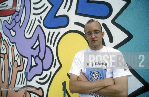 Artist Keith Haring working at the mural Tuttomondo on the rear wall of the Church of SantAntonio in Pisa, 1989 / Lartista Keith Haring mentre lavora al murale Tuttomondo sul muro posteriore della chiesa di SantAntonio abate a Pisa, 1989 - ©Marcello Mencarini/Rosebud2