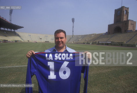 Bologna Stadium,1998. Italian operatic tenor Vincenzo La Scola shows his shirt of Italian Singers National Football Team / Stadio di Bologna, 1998. Il tenore Vincenzo La Scola mostra la sua maglia della Nazionale Italiana Cantanti - ©Marcello Mencarini/Rosebud2