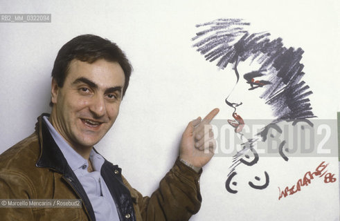 Lucca, 1986. Italian comics author and illustrator Tanino Liberatore posing next to one of his drawing / Lucca, 1986. Tanino Liberatore, disegnatore di fumetti  posa accanto a un suo disegno - ©Marcello Mencarini/Rosebud2