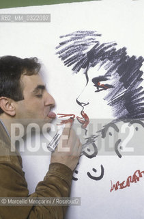 Lucca, 1986. Italian comics author and illustrator Tanino Liberatore posing next to one of his drawing / Lucca, 1986. Tanino Liberatore, disegnatore di fumetti  posa accanto a un suo disegno - ©Marcello Mencarini/Rosebud2