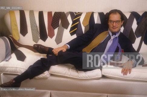 Rome, 1990. Italian sport TV journalist Fabrizio Maffei with some ties of his collection / Roma, 1990. Il giornalista televisivo, esperto di calcio, Fabrizio Maffei con alcune cravatte della sua collezione - ©Marcello Mencarini/Rosebud2