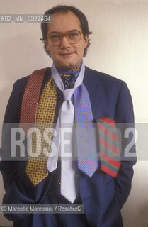 Rome, 1990. Italian sport TV journalist Fabrizio Maffei with some ties of his collection / Roma, 1990. Il giornalista televisivo, esperto di calcio, Fabrizio Maffei con alcune cravatte della sua collezione - ©Marcello Mencarini/Rosebud2